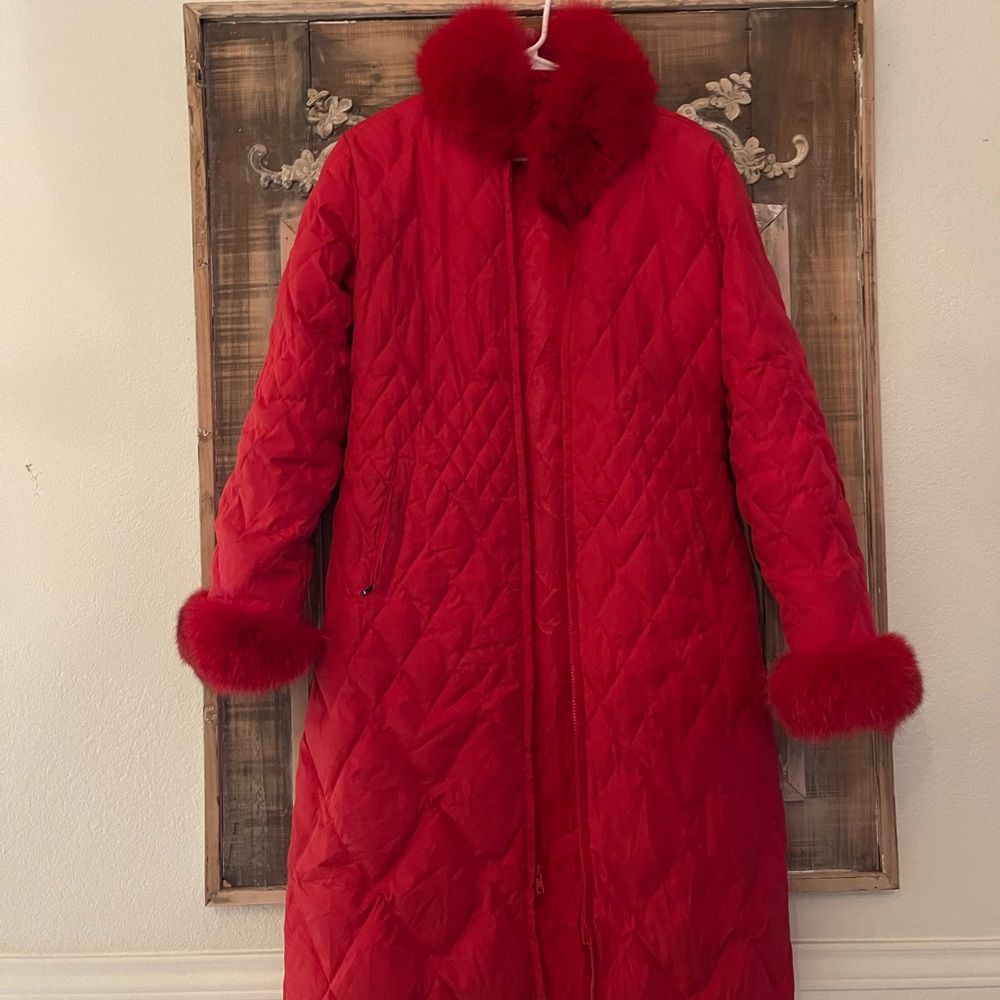 Red Marvin richards puffer jacket with fox trim.